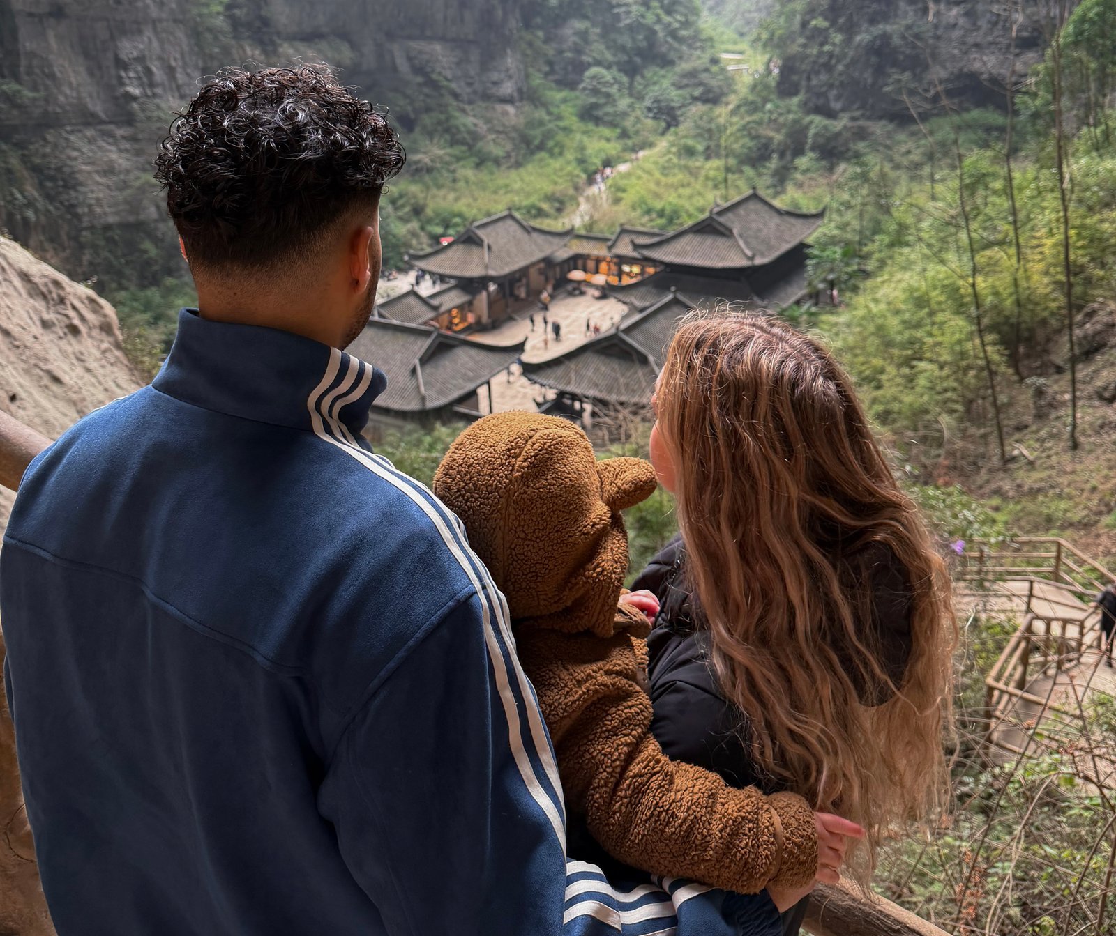 Greta, Luan, and Kaio overlooking a valley in China